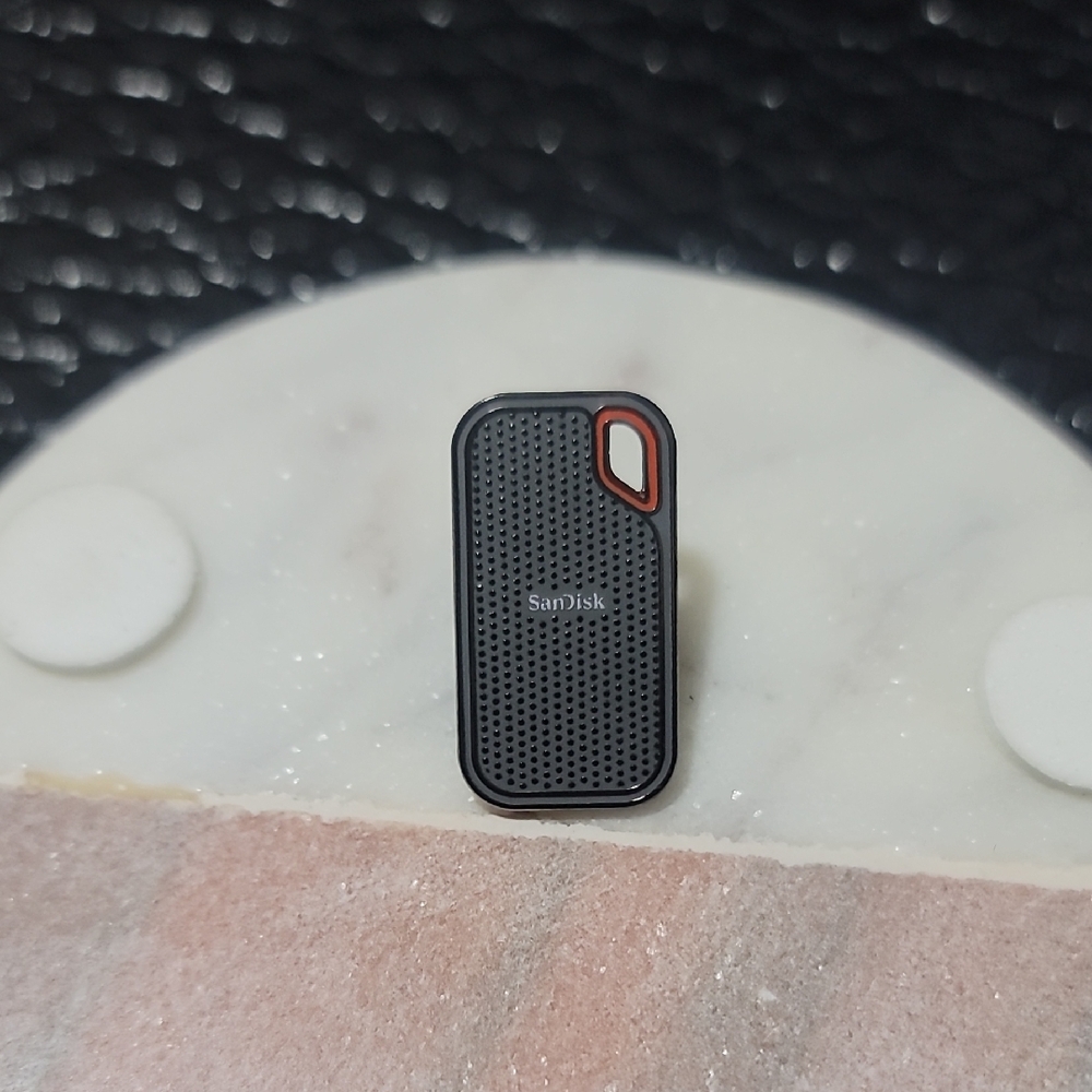 Sandisk Grey and Orange Portable SSD Enamel Pin